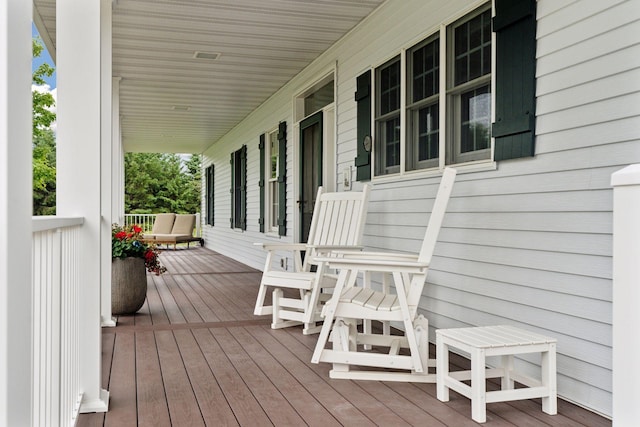 wooden deck with a porch