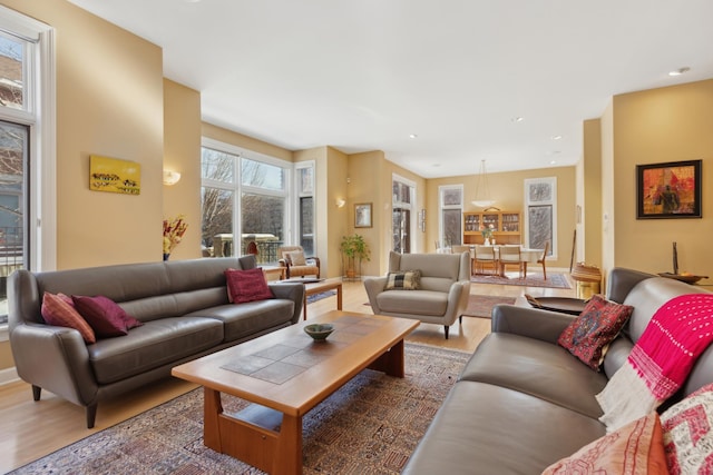 living area featuring wood finished floors and recessed lighting