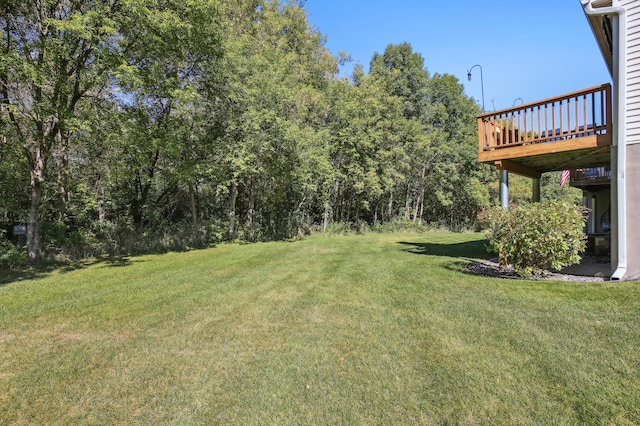 view of yard featuring a wooden deck