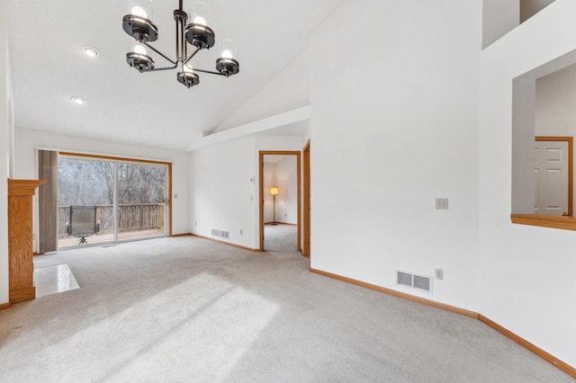 unfurnished living room with carpet floors, visible vents, baseboards, and an inviting chandelier