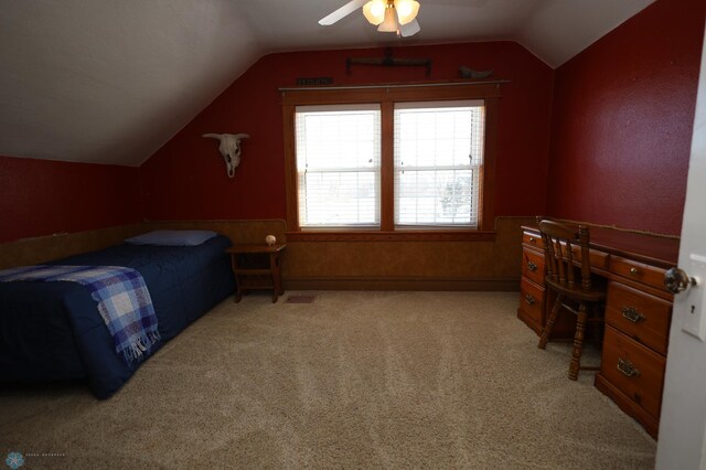 bedroom featuring lofted ceiling, light carpet, and ceiling fan