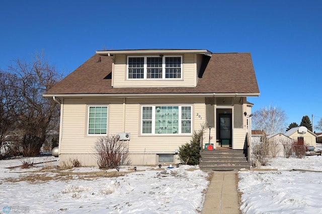 bungalow-style house with roof with shingles