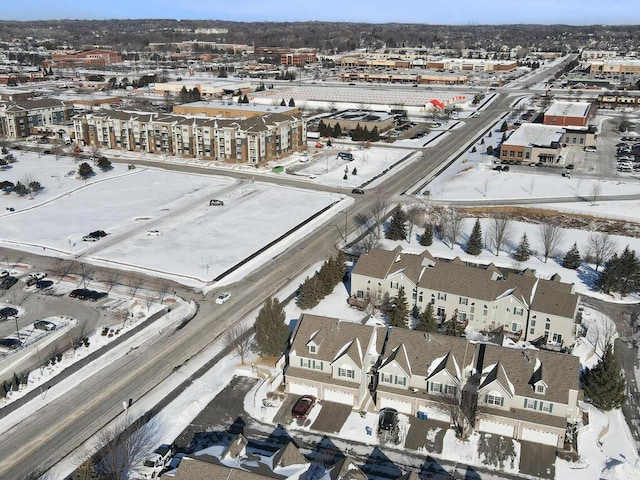 snowy aerial view with a residential view