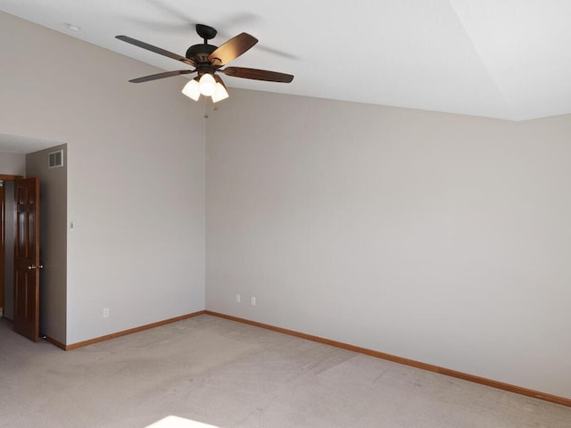 unfurnished room featuring light carpet, visible vents, baseboards, lofted ceiling, and ceiling fan