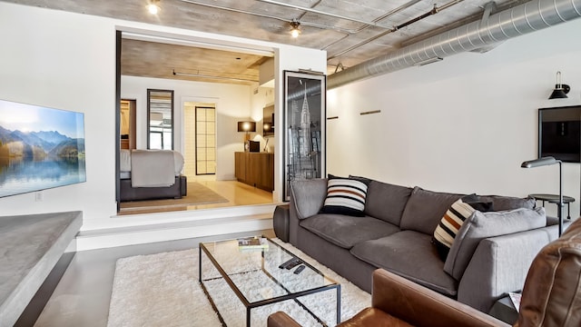 living room with concrete flooring