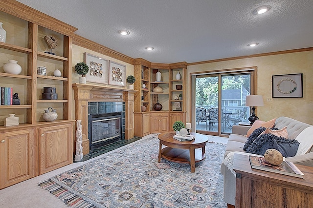 carpeted living area featuring crown molding, recessed lighting, a fireplace, and a textured ceiling