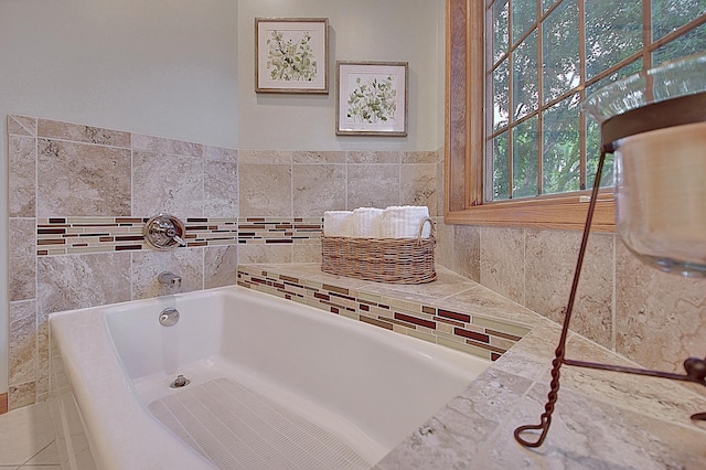 bathroom featuring a bath and tile patterned floors