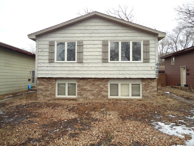 view of side of home featuring brick siding