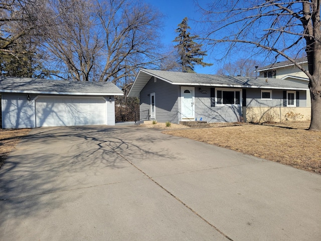 view of front facade with an outbuilding and a garage