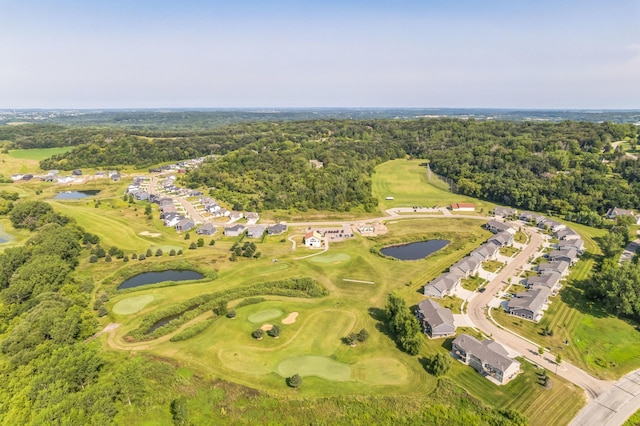 birds eye view of property featuring a residential view, a water view, a wooded view, and golf course view