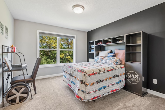 bedroom featuring carpet, a textured ceiling, and baseboards