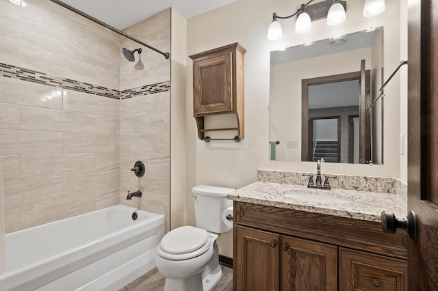 full bathroom featuring toilet, vanity, and shower / bathing tub combination