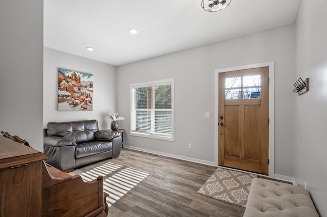 entrance foyer with plenty of natural light, baseboards, wood finished floors, and recessed lighting