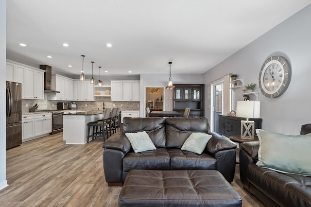 living room featuring light wood-style floors and recessed lighting