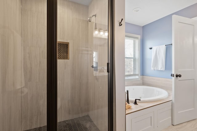 full bathroom with a garden tub and a stall shower