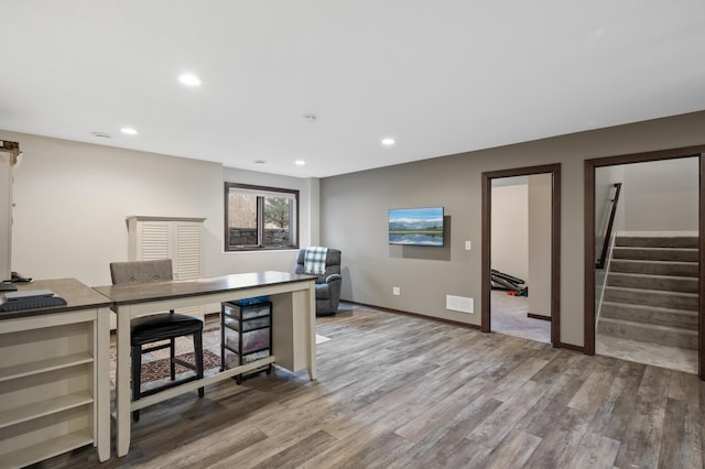 office area featuring baseboards, wood finished floors, and recessed lighting