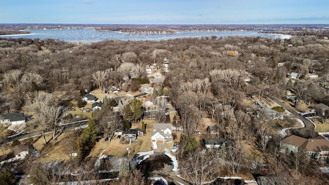 drone / aerial view featuring a residential view and a water view