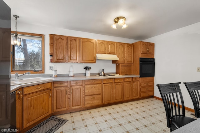 kitchen featuring light floors, white electric cooktop, a sink, oven, and under cabinet range hood