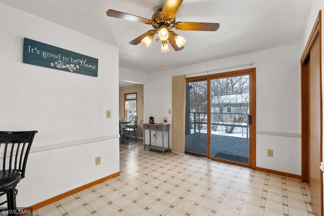 interior space with a healthy amount of sunlight, baseboards, and tile patterned floors