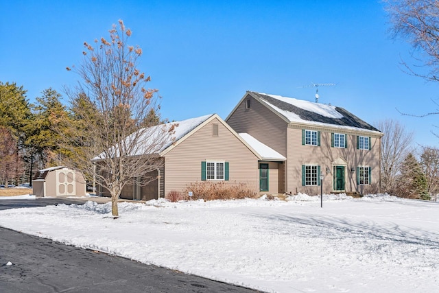 view of front of home featuring an outbuilding, a storage unit, and a garage