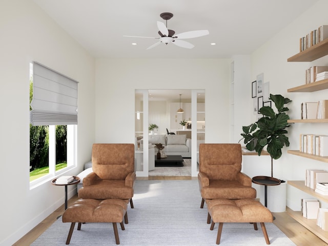 sitting room with light wood-style floors, baseboards, a ceiling fan, and recessed lighting