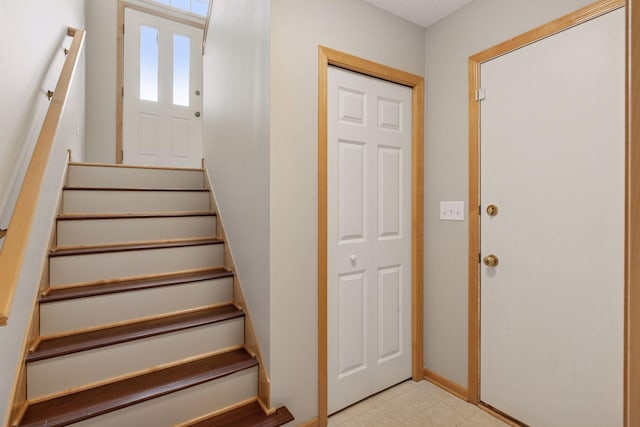 stairs featuring baseboards