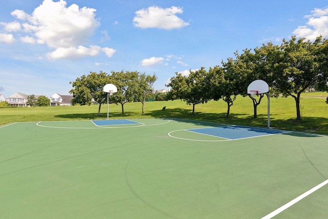 view of sport court with community basketball court and a lawn