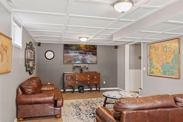 living room with visible vents, coffered ceiling, baseboards, and wood finished floors