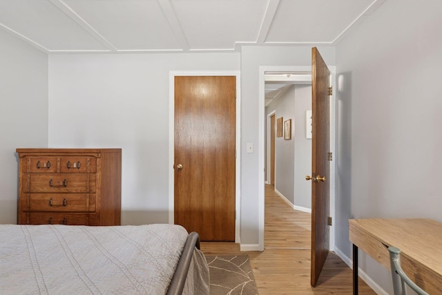 bedroom with baseboards and light wood-style floors