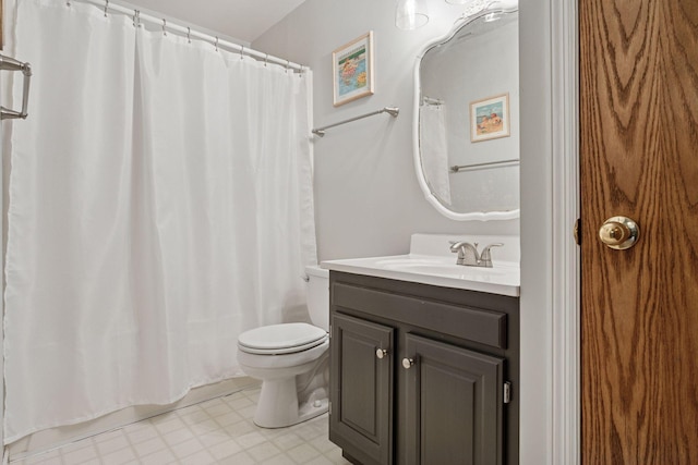 full bathroom featuring tile patterned floors, toilet, and vanity