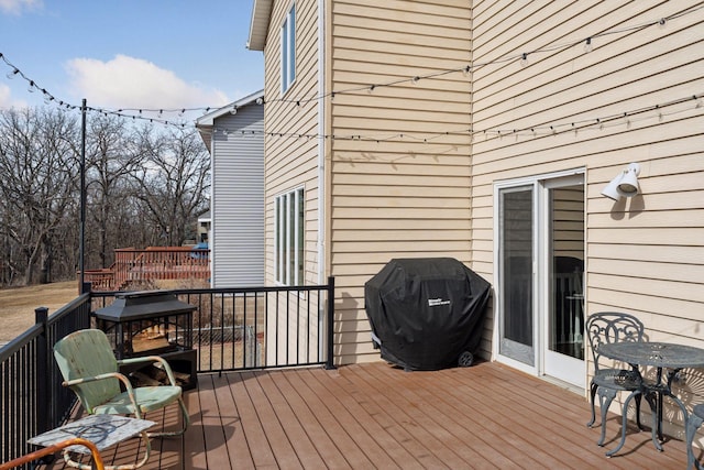 deck featuring grilling area