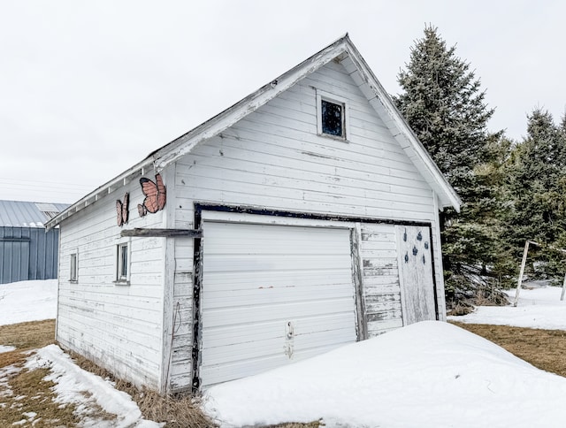 18863 State Highway 65, Goodland Twp, MN 55742 - snow covered garage featuring a detached garage