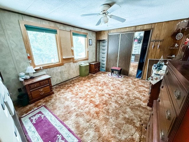 18863 State Highway 65, Goodland Twp, MN 55742 - bedroom featuring a textured ceiling, ceiling fan, and light colored carpet