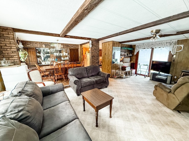 18863 State Highway 65, Goodland Twp, MN 55742 - living room featuring ceiling fan, wooden walls, beamed ceiling, and light colored carpet
