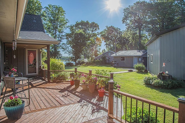 wooden terrace with a lawn