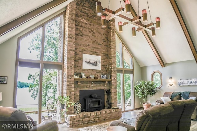 living room with high vaulted ceiling and wood finished floors