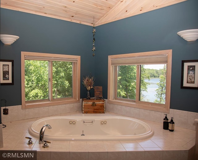 full bath with lofted ceiling, a jetted tub, and wood ceiling