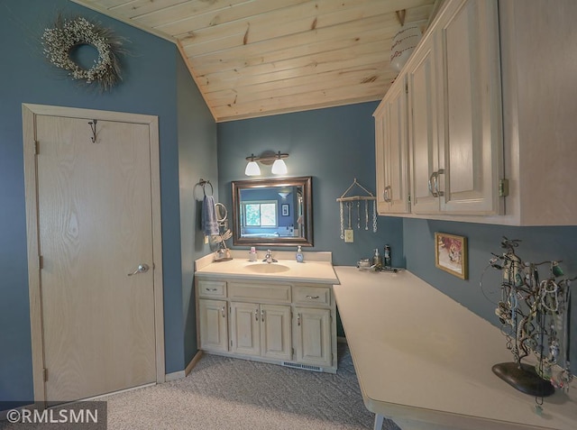 bathroom featuring lofted ceiling, wooden ceiling, and vanity