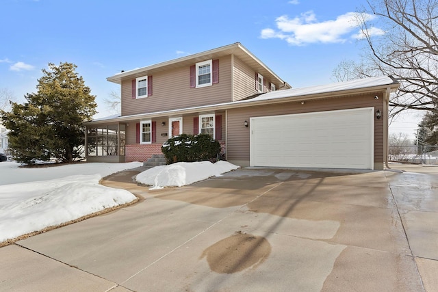 traditional-style house with a porch, driveway, and an attached garage