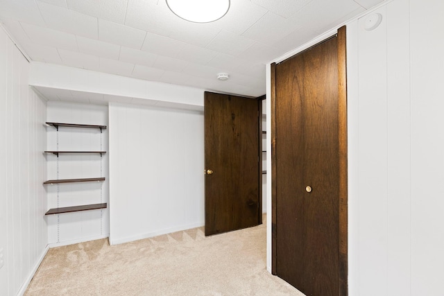 unfurnished bedroom with light colored carpet