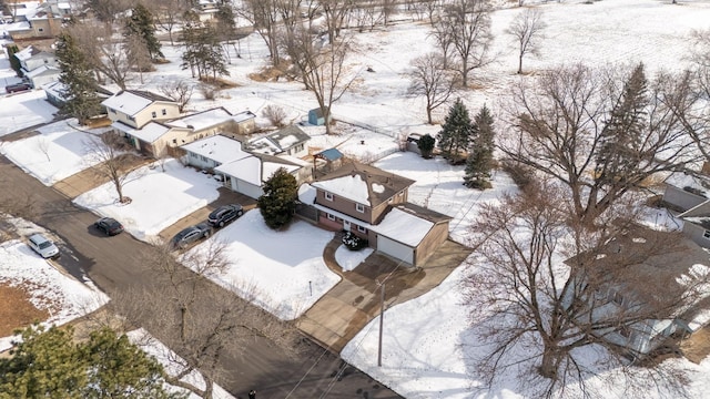 snowy aerial view featuring a residential view