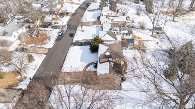 snowy aerial view featuring a residential view