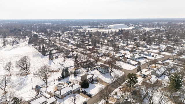 snowy aerial view featuring a residential view