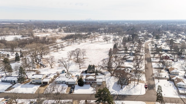 snowy aerial view with a residential view