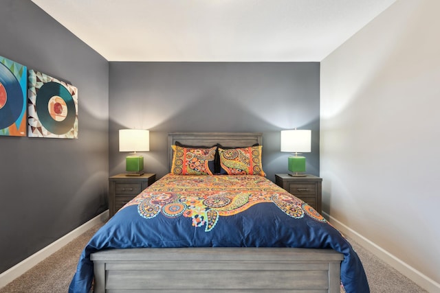 bedroom featuring carpet flooring and baseboards