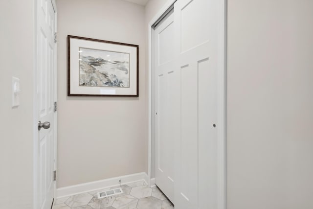 doorway to outside with visible vents and baseboards