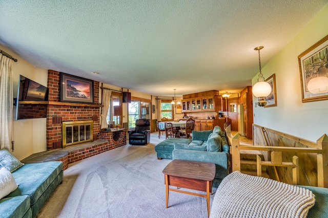 carpeted living room with a fireplace and a textured ceiling