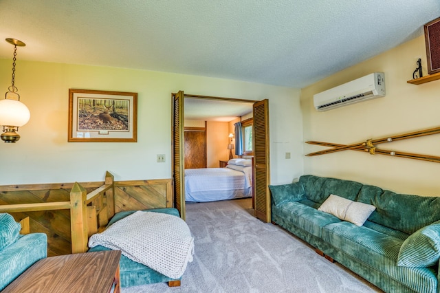 bedroom with a wainscoted wall, light colored carpet, a textured ceiling, and a wall mounted AC