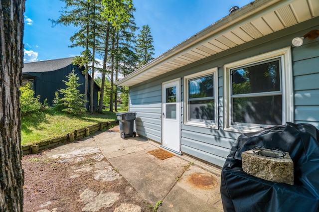 view of side of property with a patio area