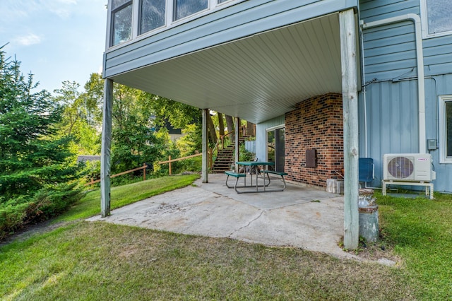 view of patio / terrace featuring ac unit and stairs